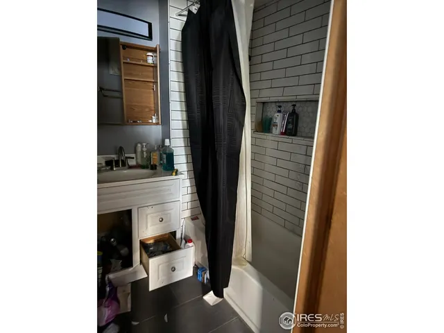 wooden floor and window in an empty room