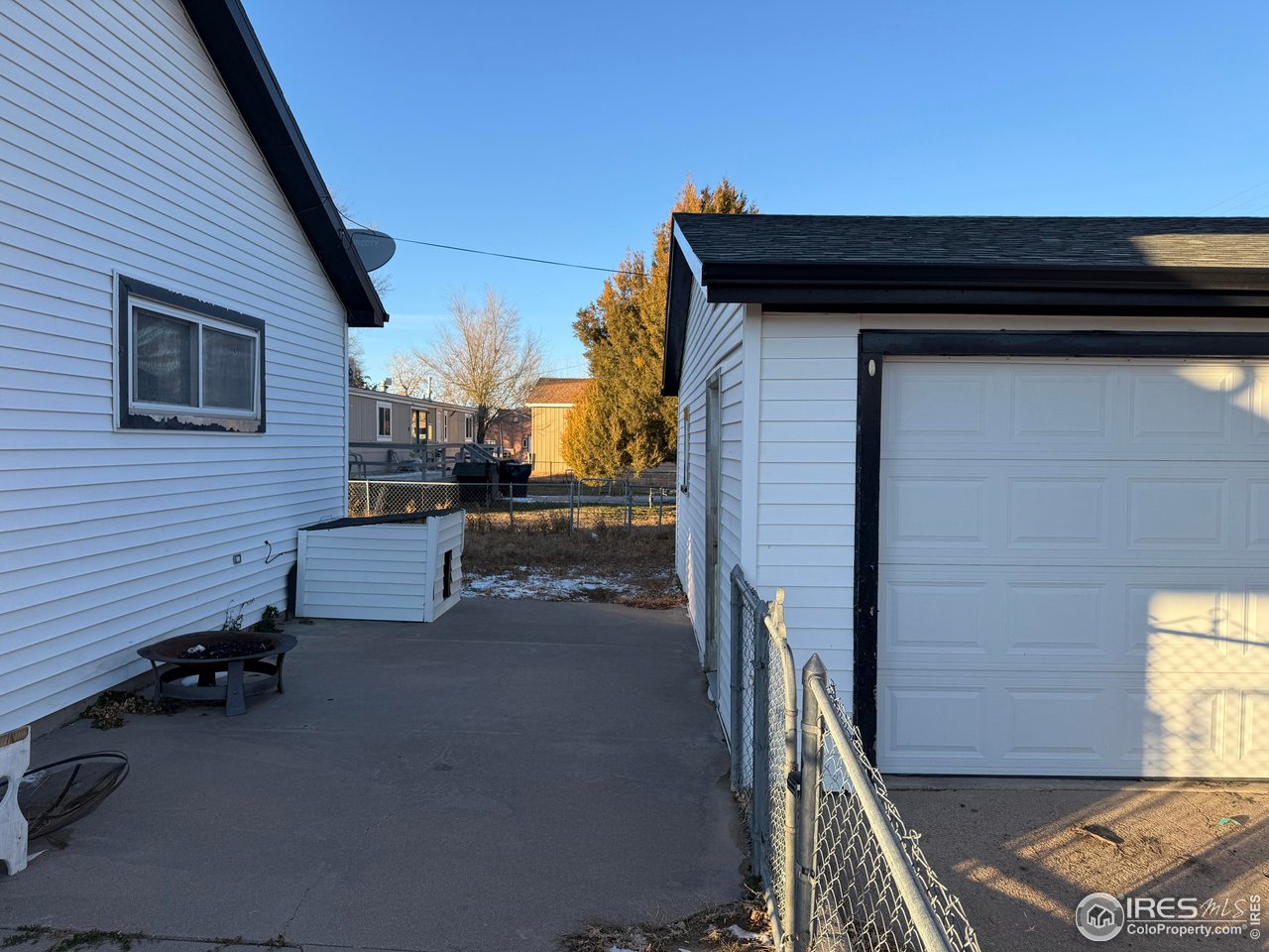 375 West 7th Street Akron, CO 80720 - Photo 37 of 50 a backyard of a house with table and chairs