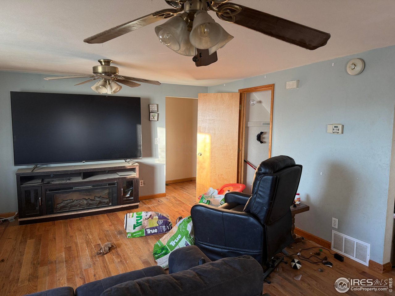 375 West 7th Street Akron, CO 80720 - Photo 5 of 50 a living room with furniture and a flat screen tv