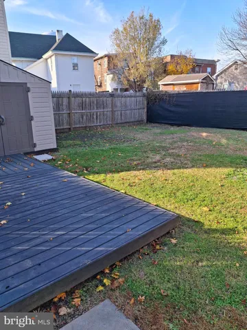 a view of a backyard with a sitting area