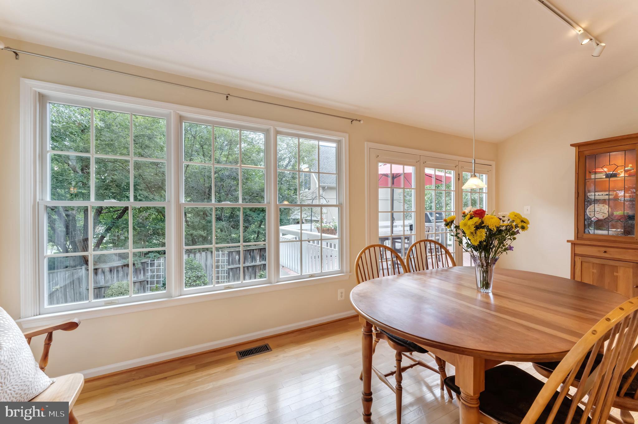 1309 Murray Downs Way Reston, VA 20194 - Photo 14 of 63 a dining room with furniture window and wooden floor