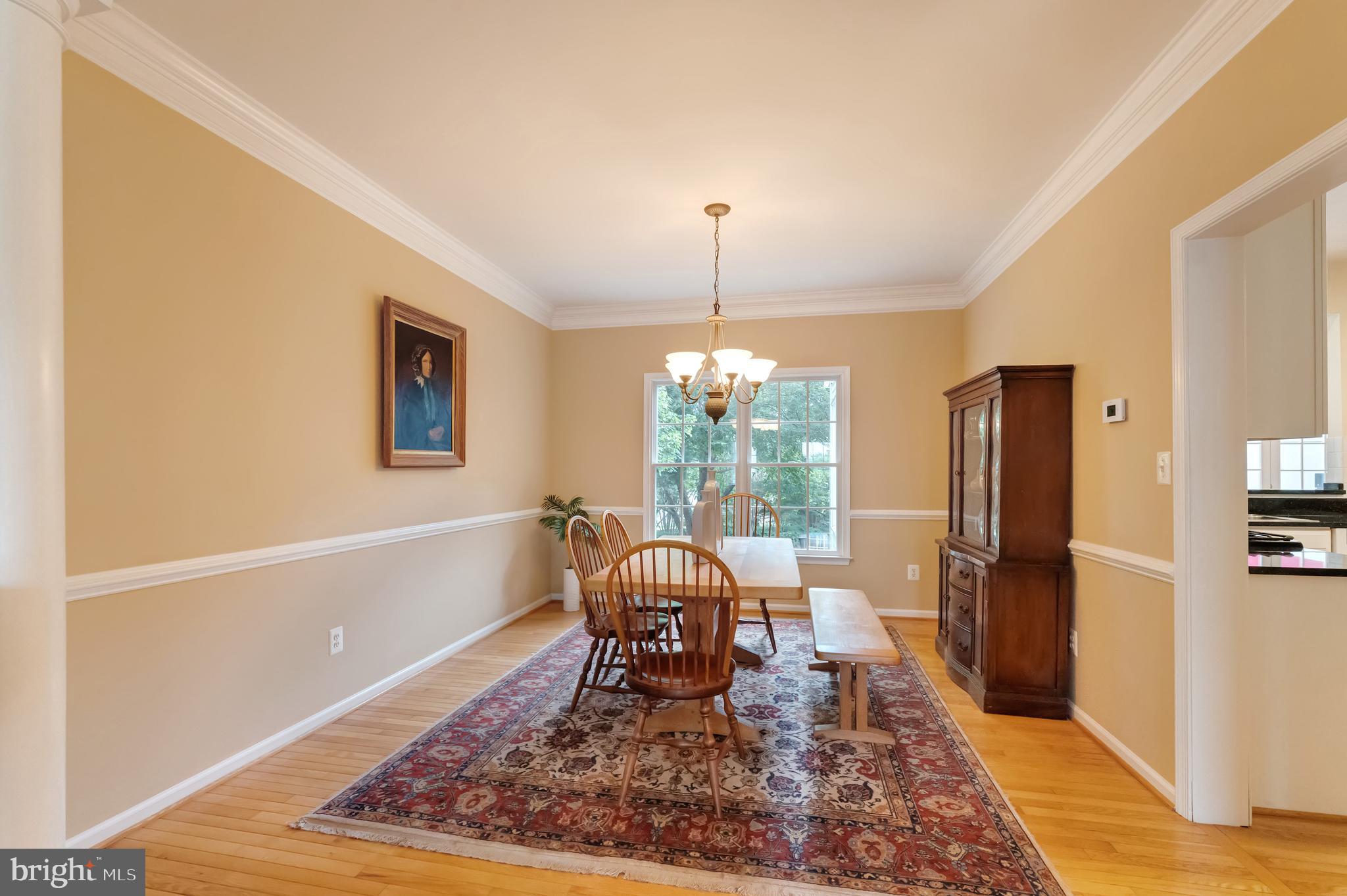 1309 Murray Downs Way Reston, VA 20194 - Photo 16 of 63 a living room with furniture and a chandelier