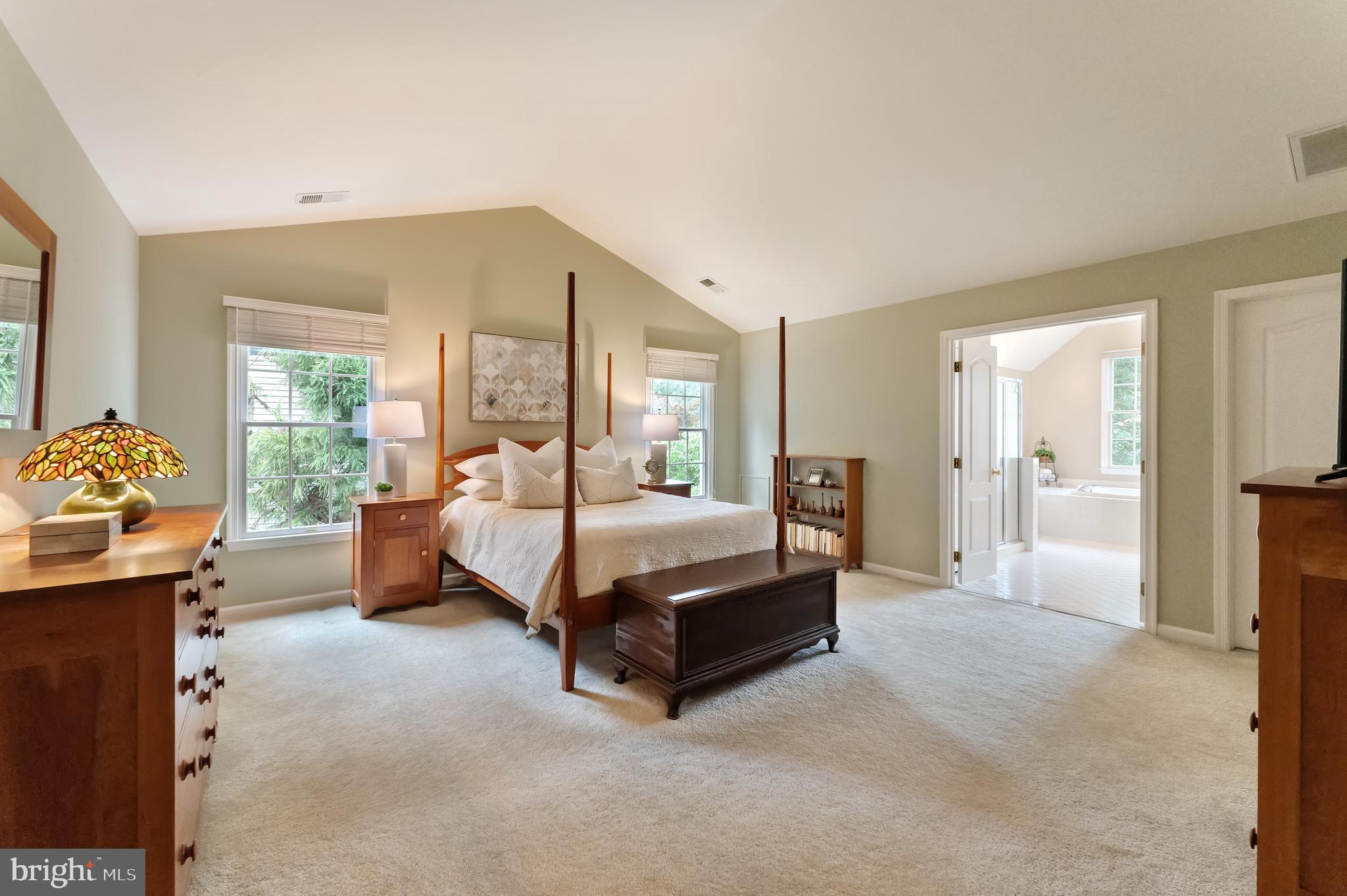 1309 Murray Downs Way Reston, VA 20194 - Photo 22 of 63 a spacious bedroom with a bed and a couch