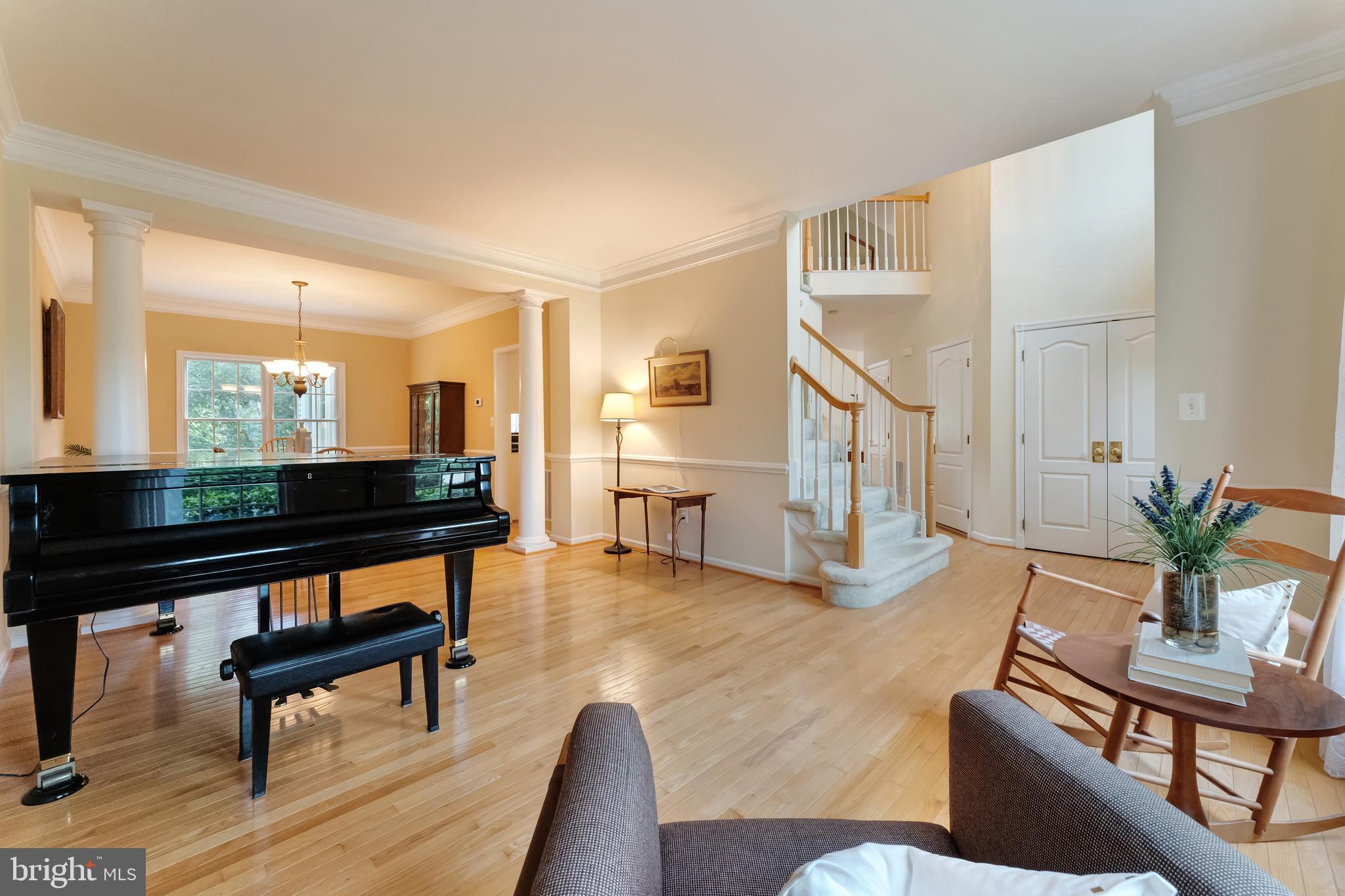 1309 Murray Downs Way Reston, VA 20194 - Photo 3 of 63 a living room with furniture and a wooden floor