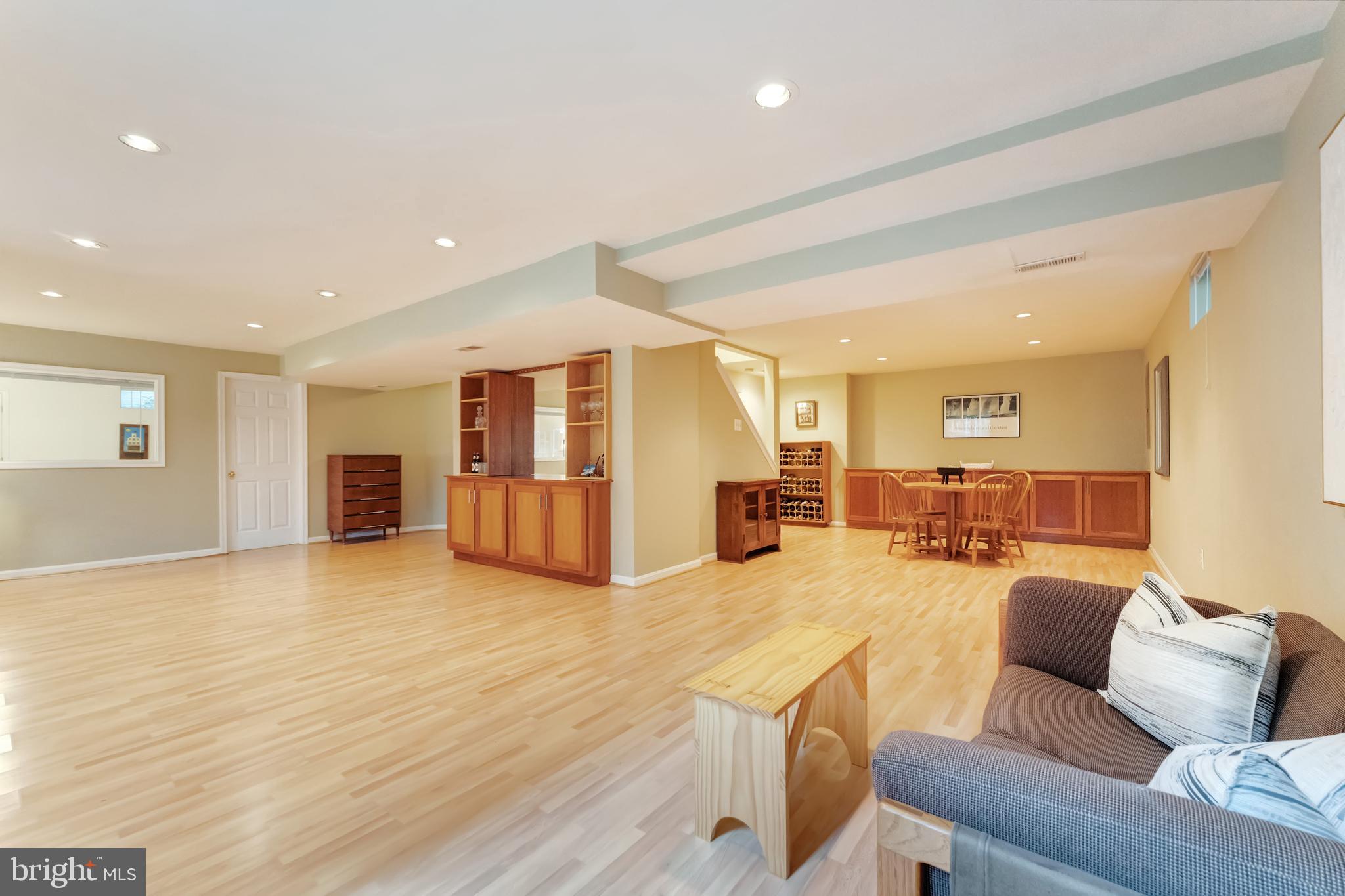 1309 Murray Downs Way Reston, VA 20194 - Photo 39 of 63 a living room with furniture and kitchen view