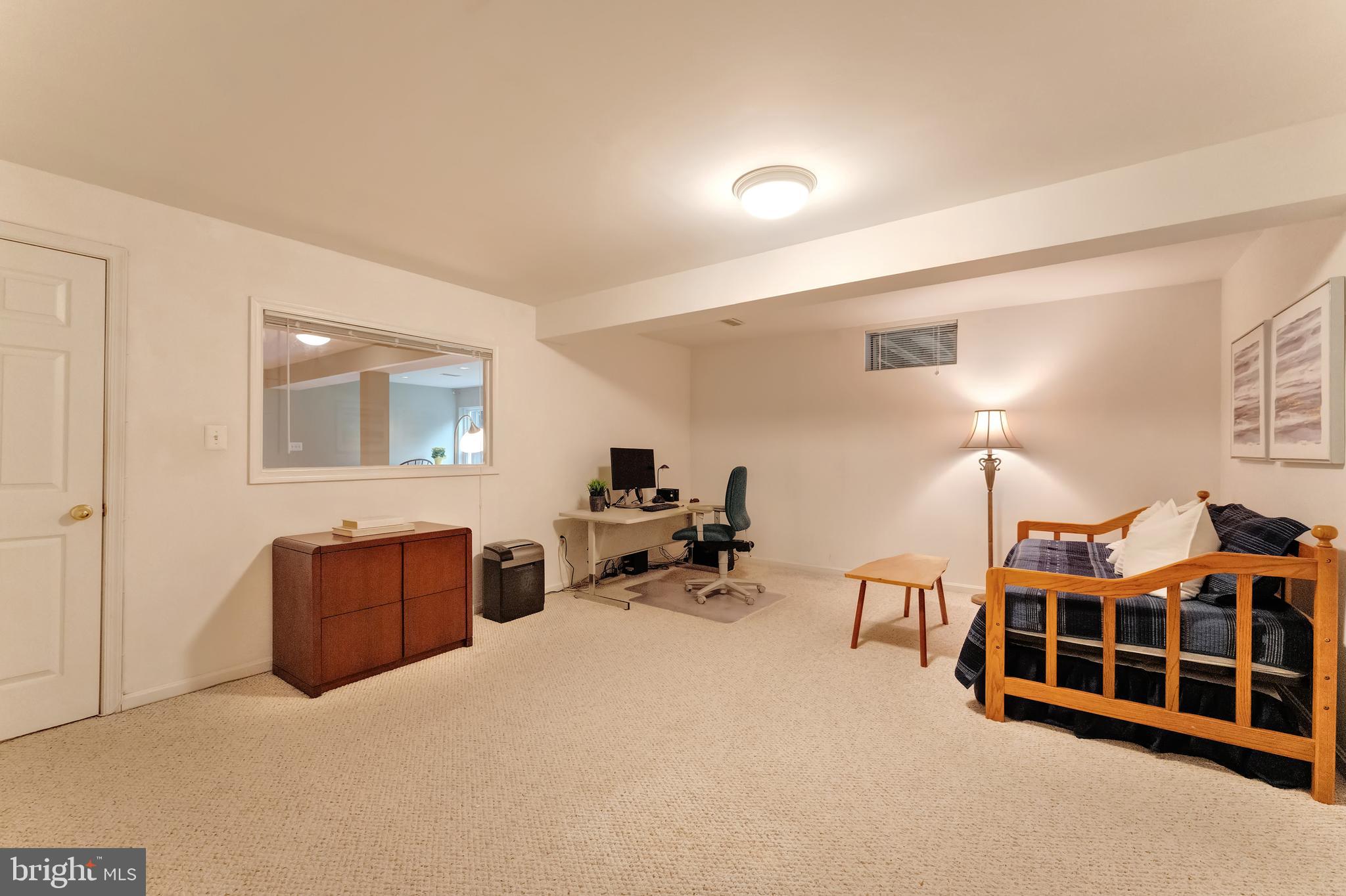 1309 Murray Downs Way Reston, VA 20194 - Photo 42 of 63 a bedroom with furniture and a lamp
