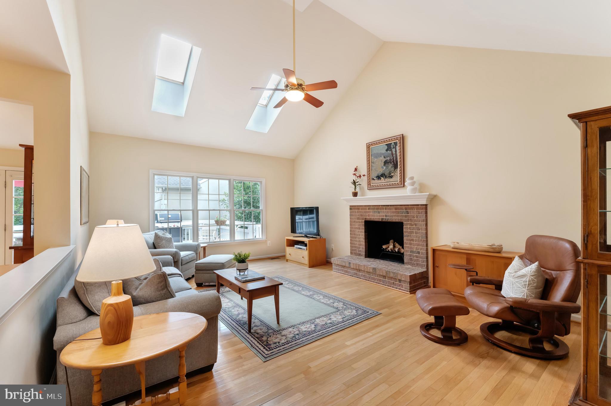 1309 Murray Downs Way Reston, VA 20194 - Photo 8 of 63 a living room with furniture fireplace and window