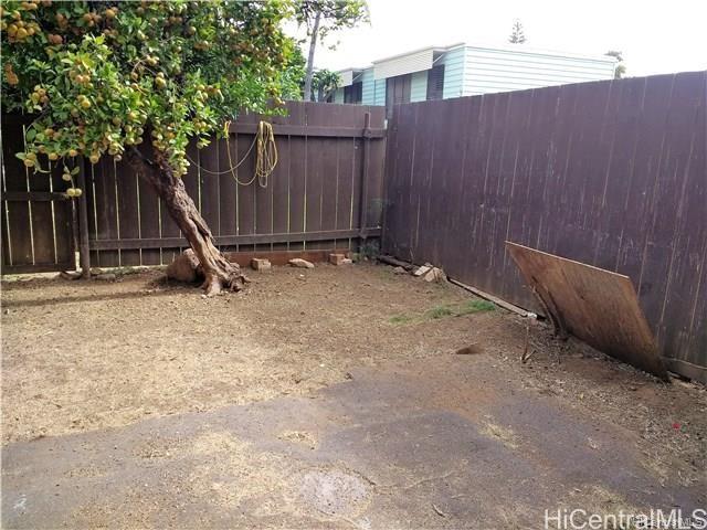 87-149 Helelua Street, Unit 3 Waianae, HI 96792 - Photo 3 of 5 a backyard of a house
