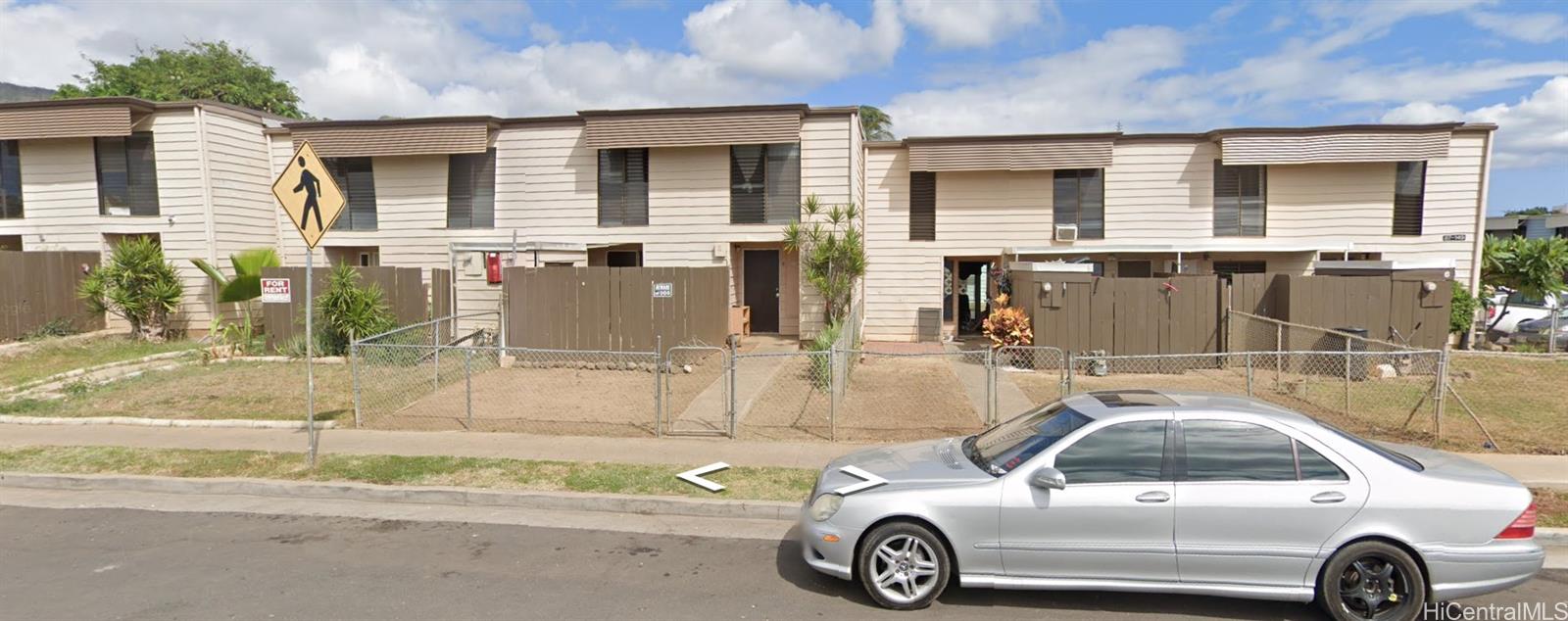 87-149 Helelua Street, Unit 3 Waianae, HI 96792 - Photo 5 of 5 a view of a car parked in front of a house