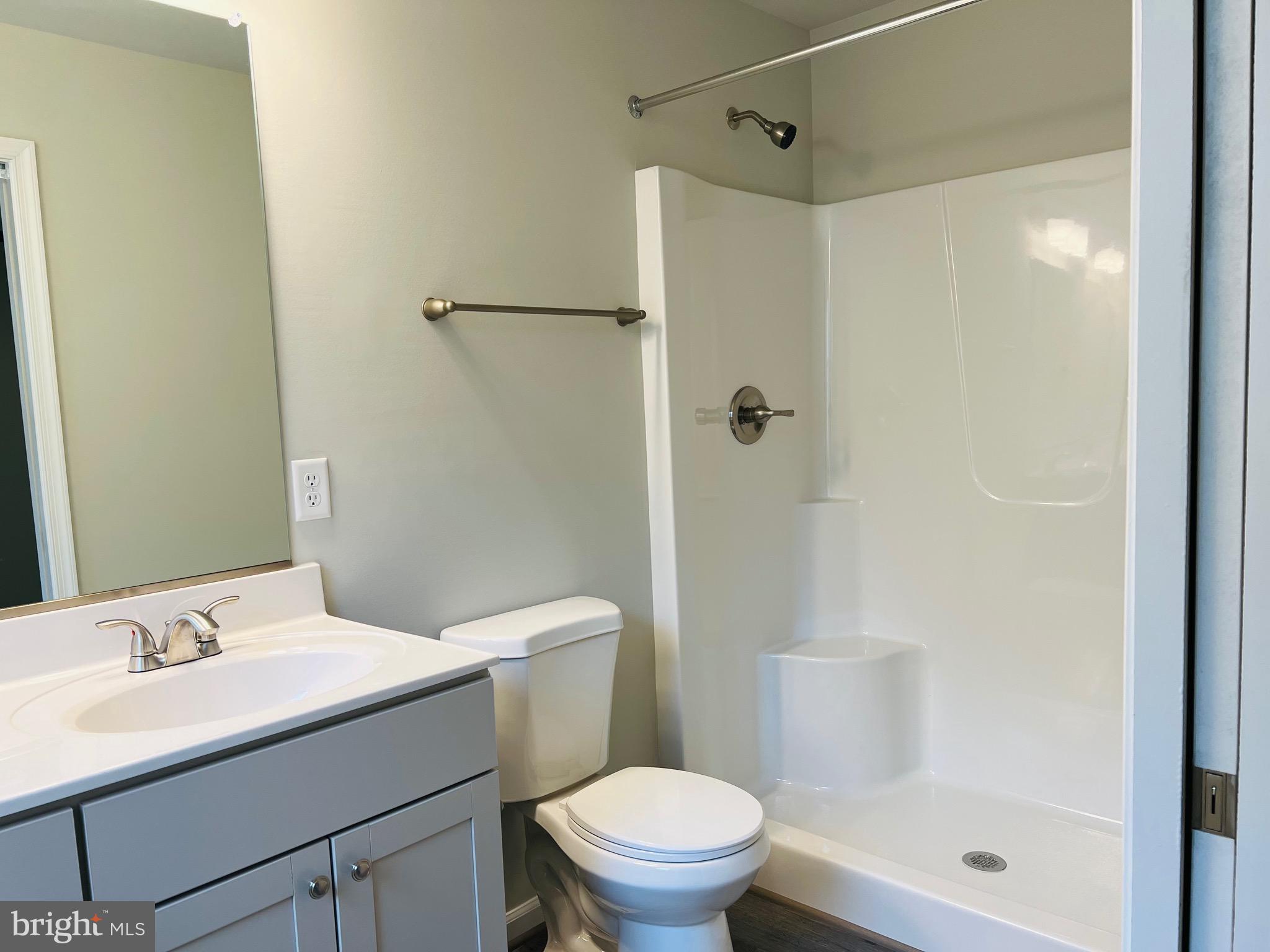 255 9th Street Colonial Beach, VA 22443 - Photo 15 of 18 a bathroom with a sink a toilet and shower