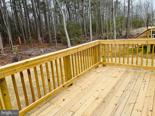 a view of balcony with wooden floor