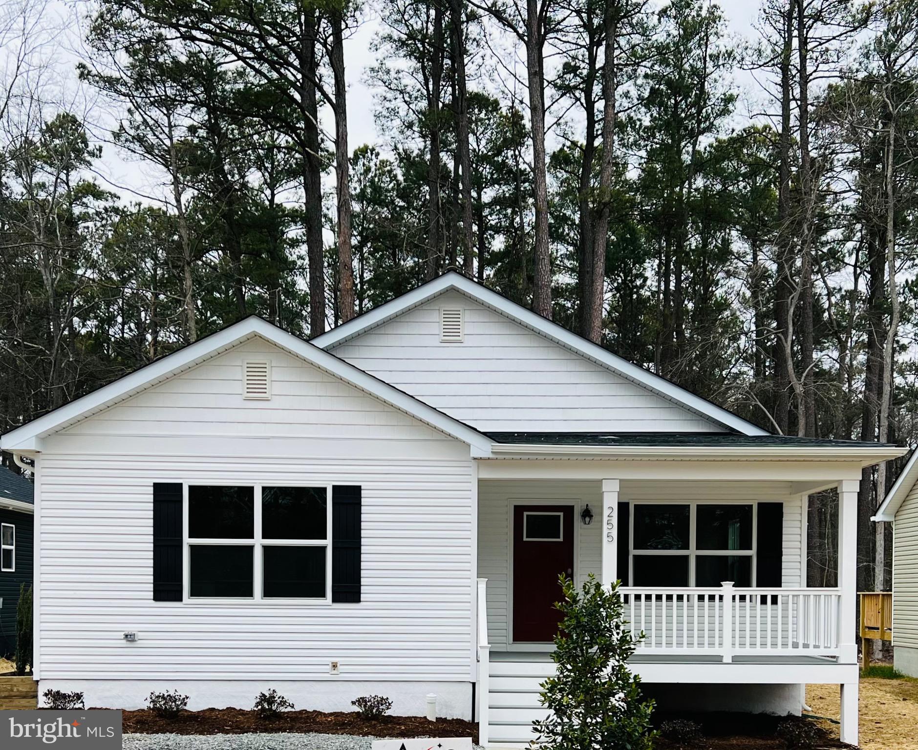 255 9th Street Colonial Beach, VA 22443 - Photo 2 of 18 a view of a house with yard and balcony