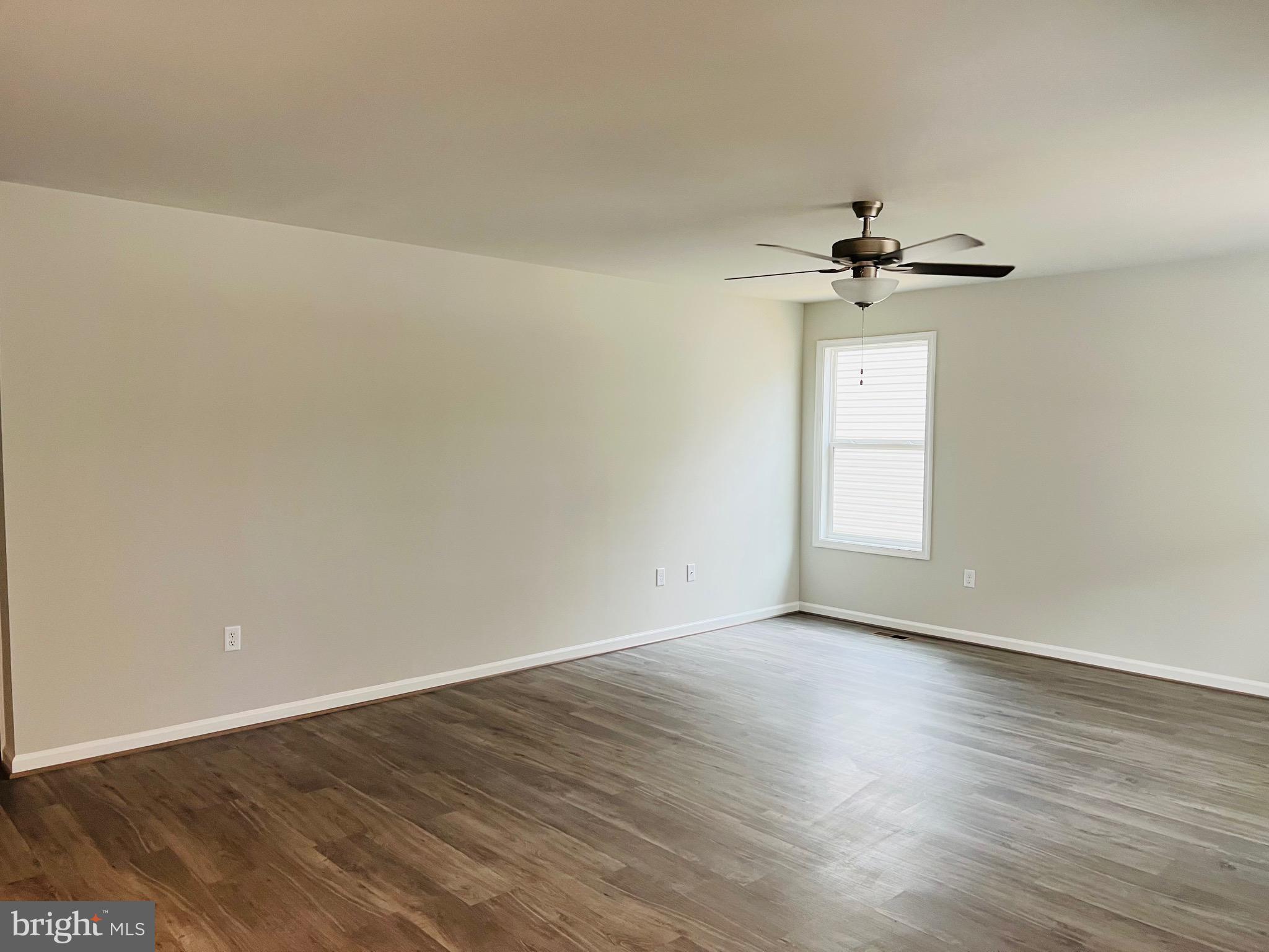 255 9th Street Colonial Beach, VA 22443 - Photo 7 of 18 wooden floor in an empty room