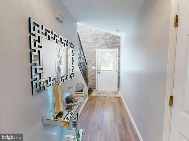 a view of entryway with wooden floor