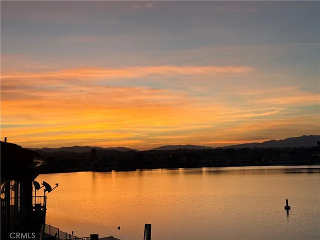 a view of lake with sunset