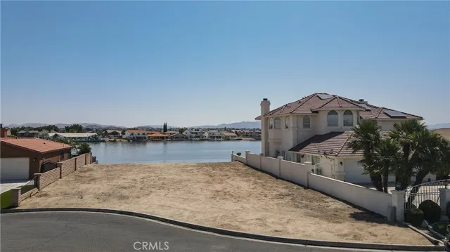 an aerial view of a house with a yard and garage