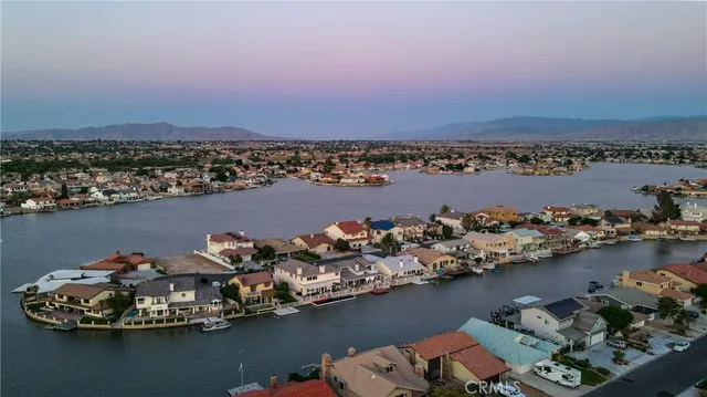 an aerial view of a house with a lake view