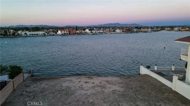 a view of a ocean with a mountain in the background