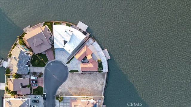 a wooden bench sitting in middle of a beach