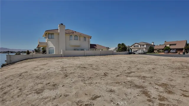an aerial view of a house with a lake view