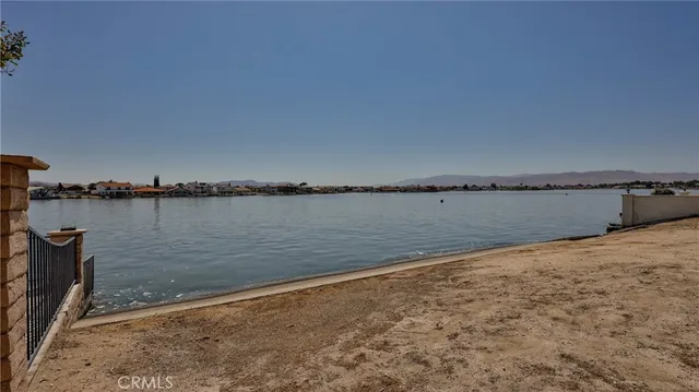an aerial view of a residential apartment building with a yard