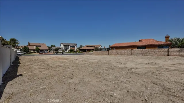 an aerial view of a houses with a yard