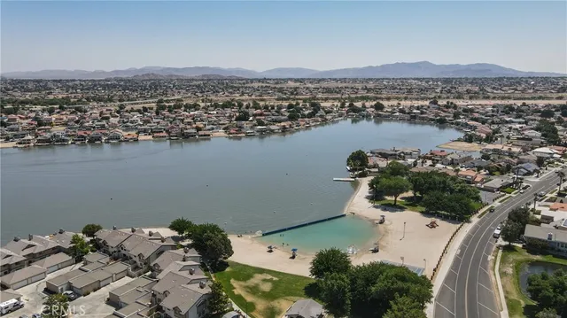 an aerial view of a residential houses with outdoor space