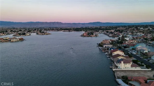 an aerial view of a house with a lake view