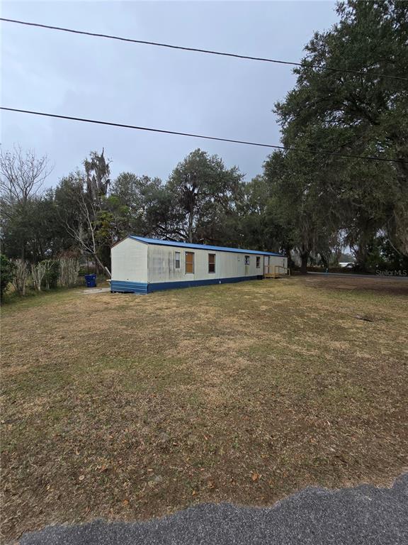 20 Southwest 3rd Street Webster, FL 33597 - Photo 3 of 5 a view of a big yard with large trees