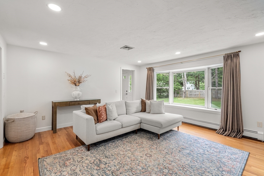322 Concord Road Wayland, MA 01778 - Photo 10 of 35 a living room with furniture and a rug