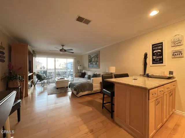 a view of living room with furniture and a flat screen tv