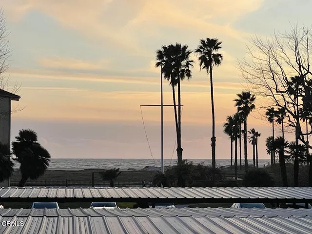 a view of ocean with a terrace