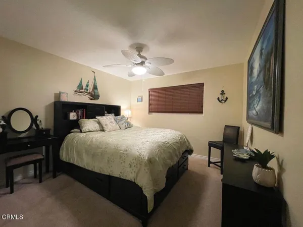 a bedroom with a bed and dresser