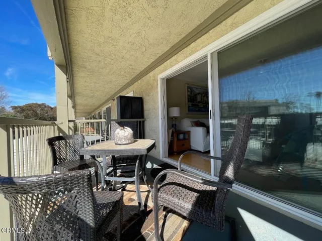 a view of a chairs and table on the terrace