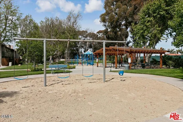 a view of a playground with basketball court