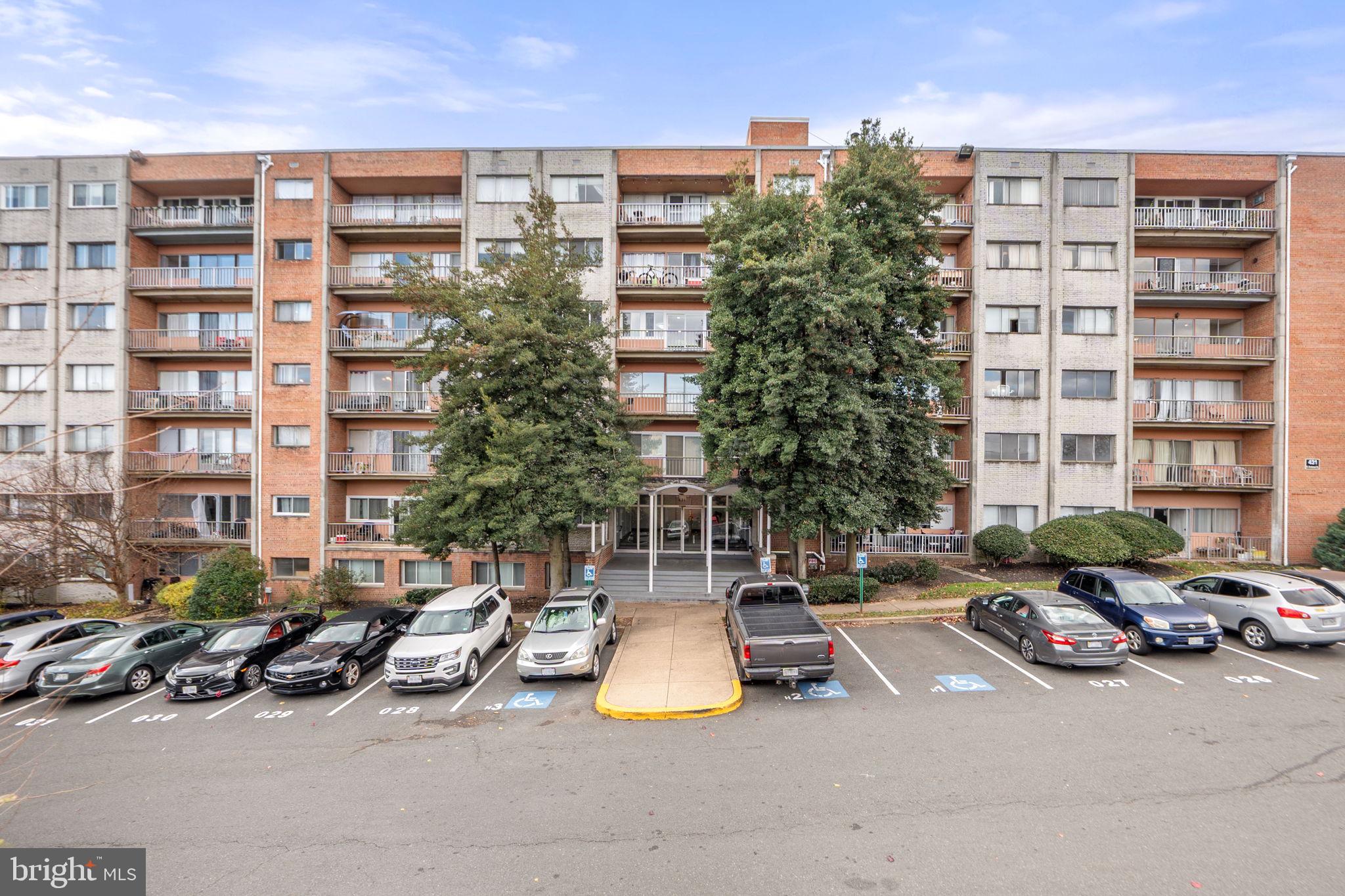 431 North Armistead Street, Unit 211 Alexandria, VA 22312 - Photo 26 of 27 a couple of cars parked in front of a building