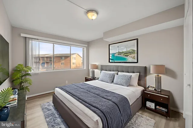 a bedroom with bed and a window