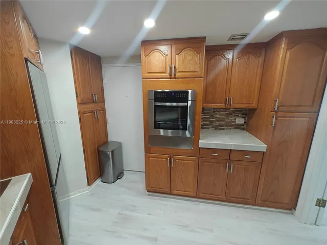 a view of a livingroom with furniture and a potted plant