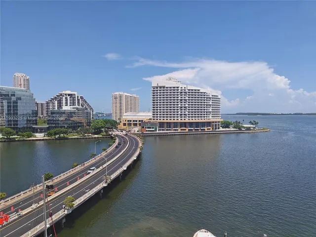 a view of a city with a lake