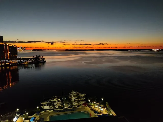 a bathroom with a sink mirror toilet and shower
