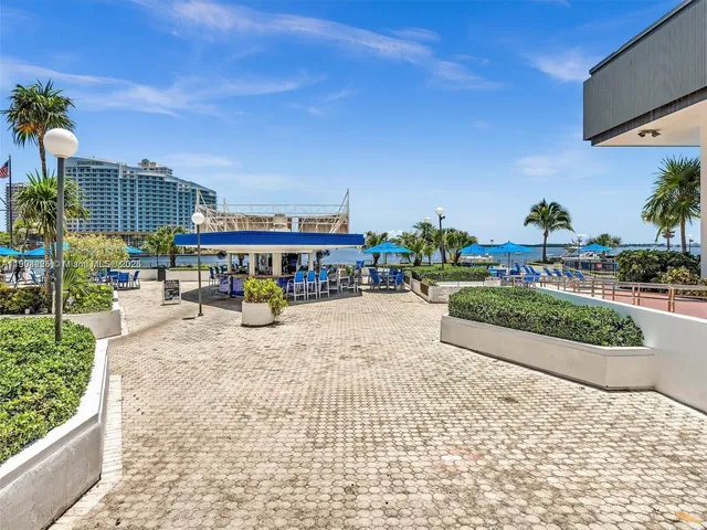 a view of living room and kitchen with a large window