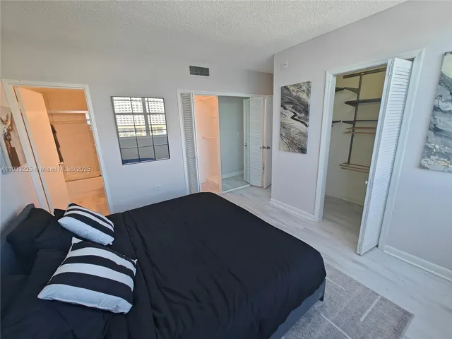a view of a livingroom with furniture and hardwood floor