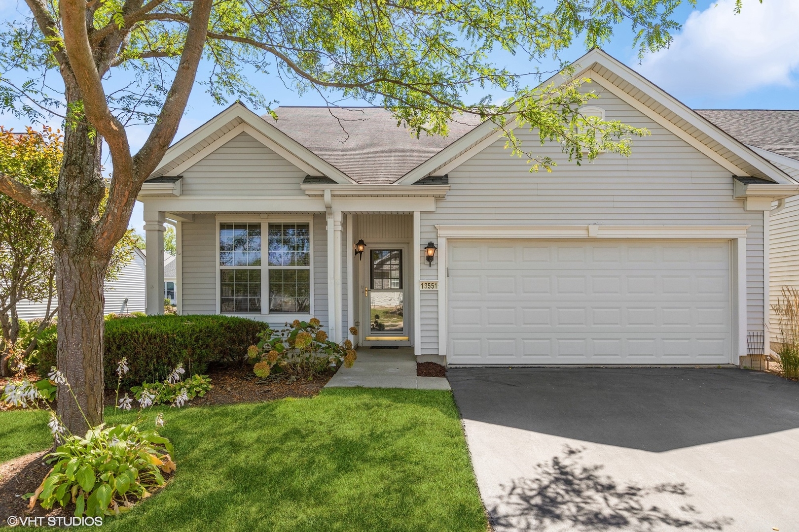 13551 Nealy Road Huntley, IL 60142 - Photo 1 of 15 a front view of a house with garden