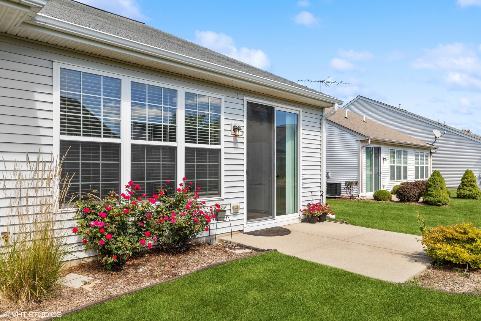 13551 Nealy Road Huntley, IL 60142 - Photo 14 of 15 a front view of a house with a yard and outdoor seating