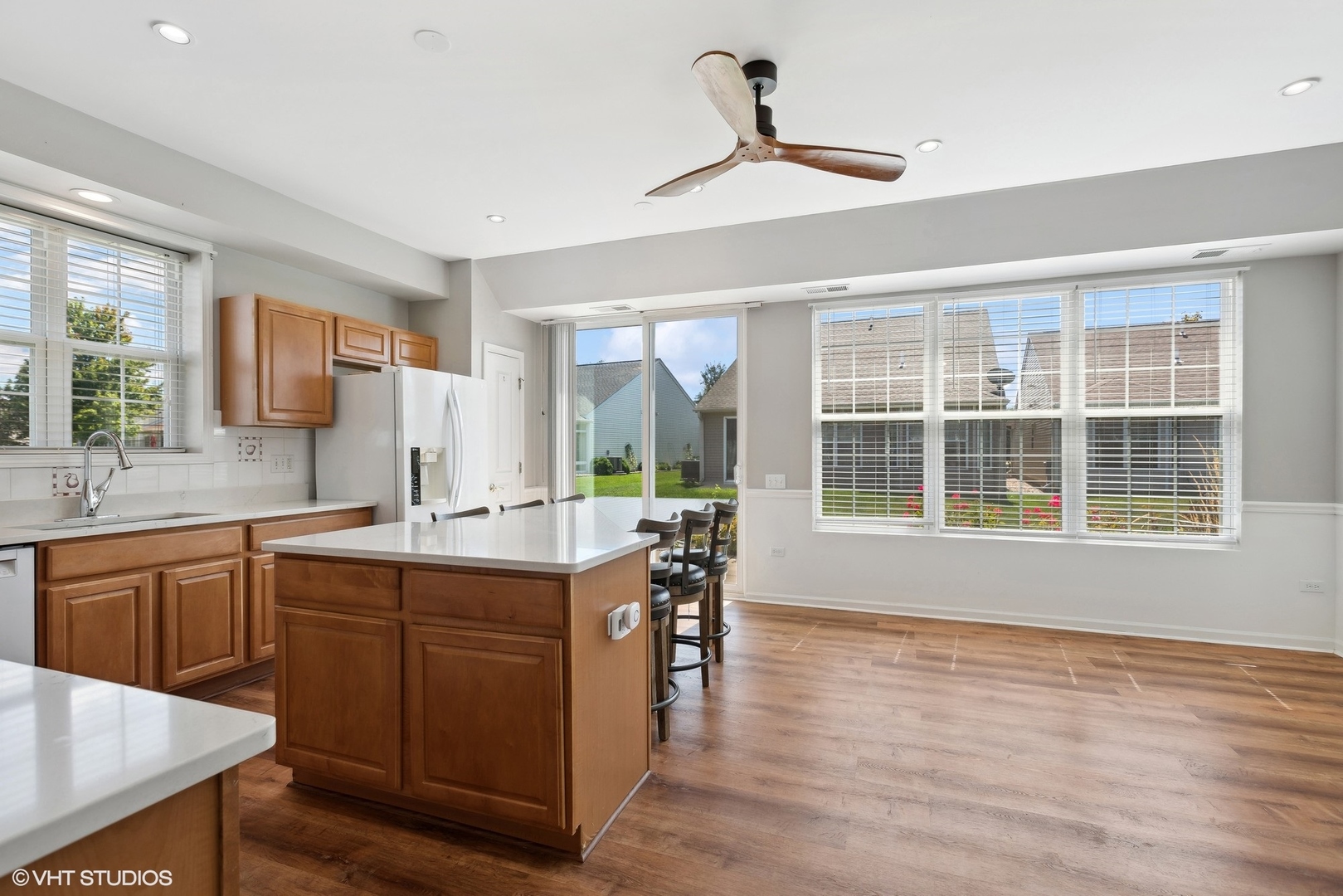 13551 Nealy Road Huntley, IL 60142 - Photo 4 of 15 a kitchen with stainless steel appliances granite countertop a sink stove and wooden cabinets