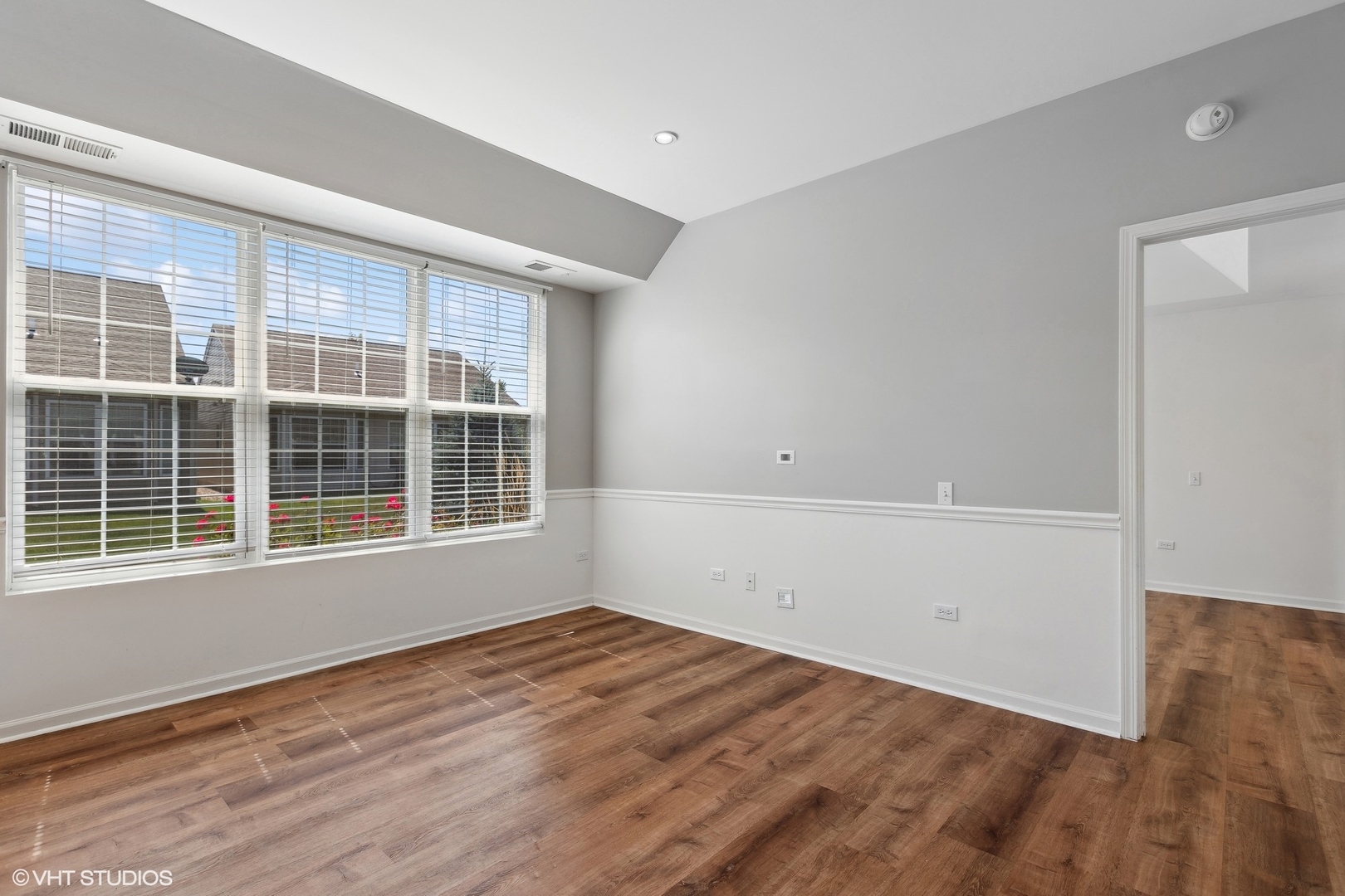 13551 Nealy Road Huntley, IL 60142 - Photo 5 of 15 a view of empty room with wooden floor and fan
