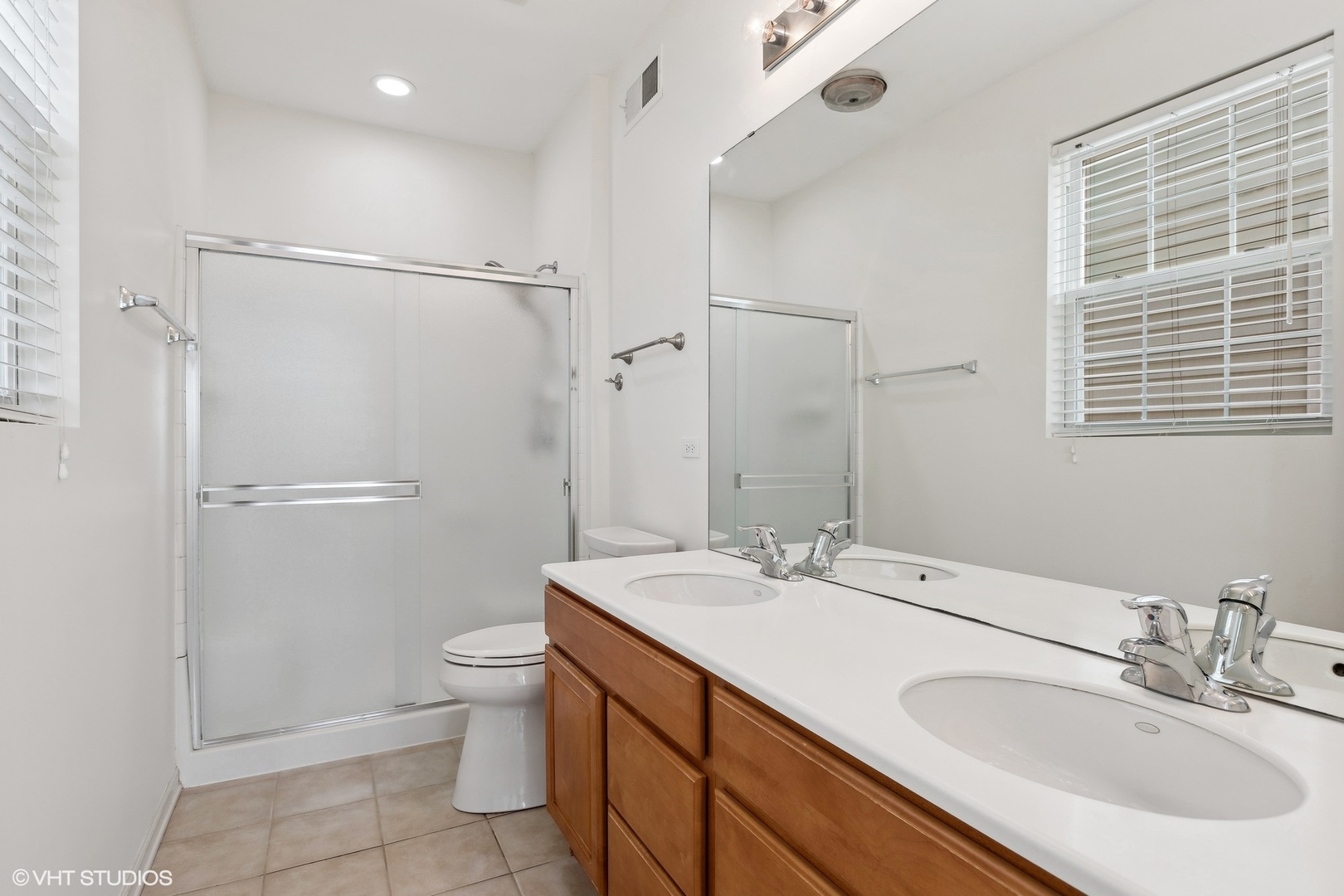 13551 Nealy Road Huntley, IL 60142 - Photo 7 of 15 a bathroom with a sink toilet double vanity and shower