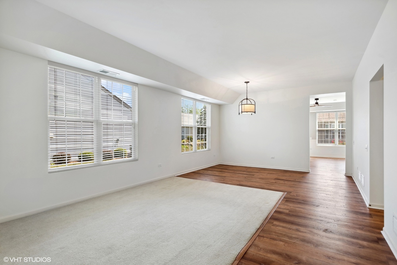 13551 Nealy Road Huntley, IL 60142 - Photo 9 of 15 a view of an empty room with wooden floor and a window