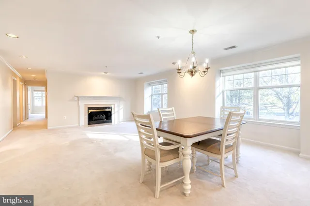 a view of a dining room with furniture window and chandelier