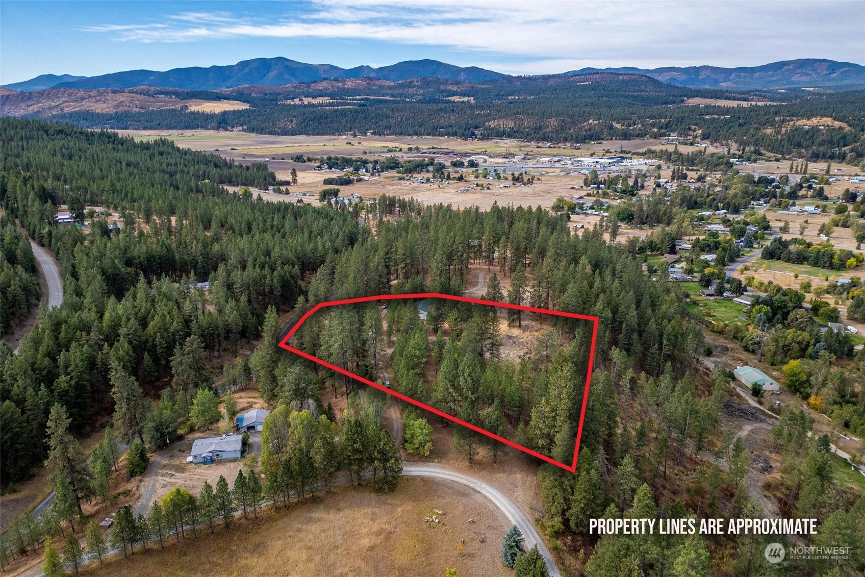 745 D Hall Road Colville, WA 99114 - Photo 2 of 27 a view of a balcony with a yard and lake view